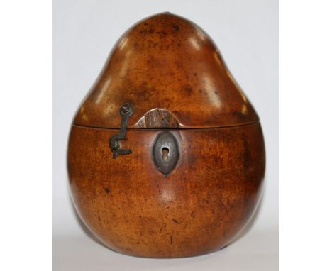 An early 19th c. Fruitwood Tea Caddy in the form a Pear, stalk missing and hinge broken, 6 1/4'' tall.