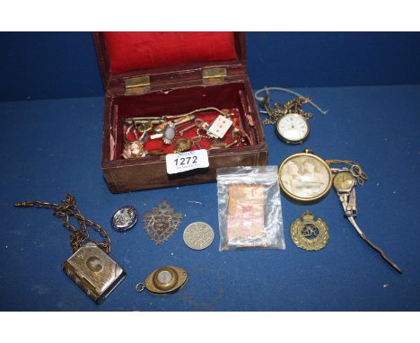 Three military badges, a Vesta Case in the form of a book, magnifying glass and compass, etc., in a Leather Box