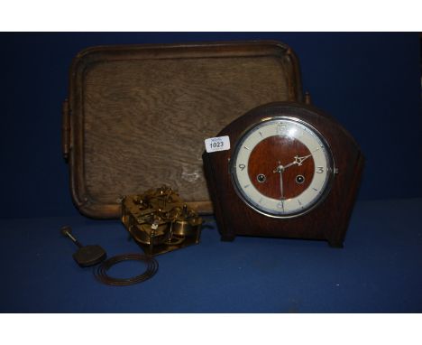 A wooden tray, an Andrew wooden cased chiming mantle Clock plus spare clock movement.