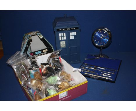 A Japanese made two jewel Alarm Clock, a collection of Star Wars figures, a set of drawing instruments and a 1963 Tardis Poli