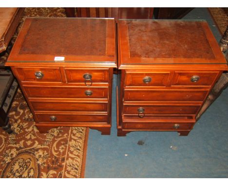 A pair of reproduction Georgian style Bedside Chests of two short over three long drawers, Yew finish with burr tops and cros