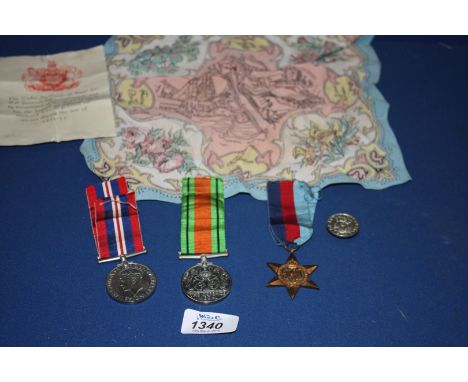 Three unnamed 2nd World War Medals being a War Medal 1939-45, Defence Medal, The 1939-45 Star and a Loyal Service Button toge