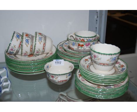 A Copeland Spode 'Chinese Rose' Teaset comprising eleven plates, four dishes, six cups and eight saucers, six tea plates and 