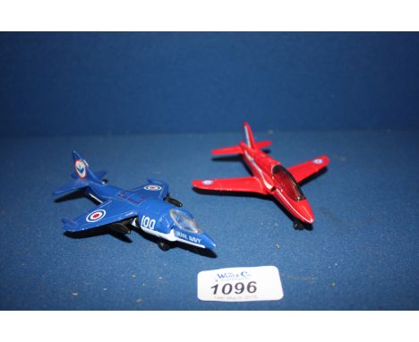 Two Matchbox Aeroplanes: a 1991 Red Arrow Hawk MKI and a 1980 Harrier Jump Jet.