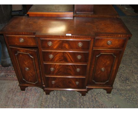 A reproduction flame Mahogany Georgian style breakfront Sideboard of small proportions, with well figured top with cross band
