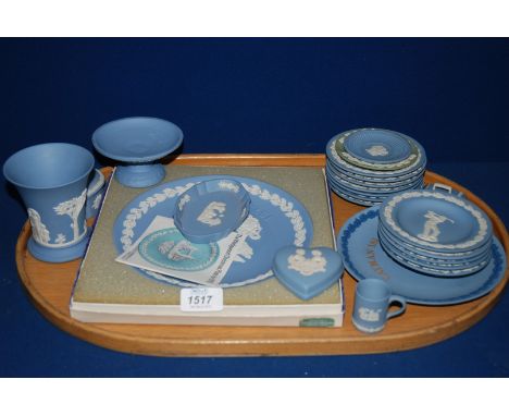 A quantity of blue Wedgwood Jasperware including miniature mug, display plate, pin trays, candlestick, vases, etc.