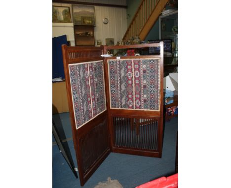 A two fold Mahogany framed Corner Screen with shelf