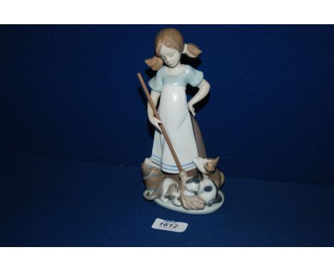 A Lladro figurine of a Young Girl with a Mop and Bucket and three Cats Playing, 8 1/4" tall