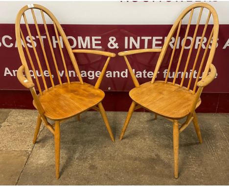 A pair of Ercol Blonde elm and beech Quaker elbow chairs 