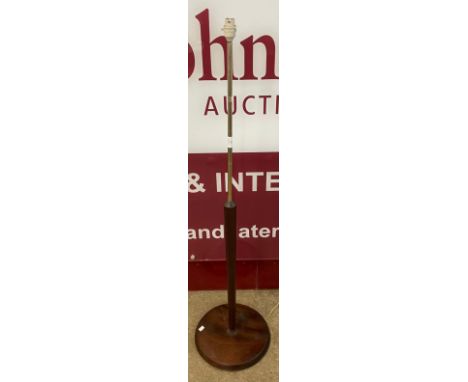 A teak standard lamp 