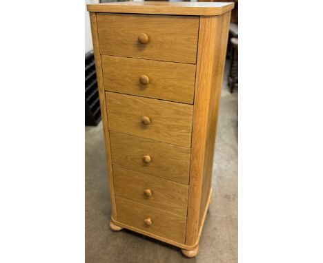 A light oak chest of drawers 