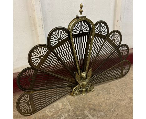 A Victorian style brass peacock folding firescreen 