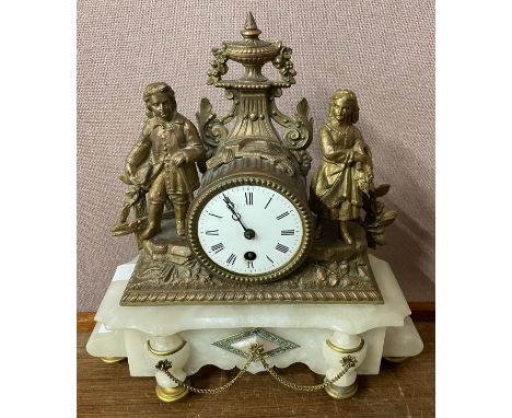 A French gilt metal and alabaster figural mantel clock 