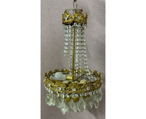 A gilt metal and glass chandelier 