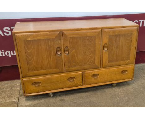 An Ercol Blonde elm Windsor sideboard 