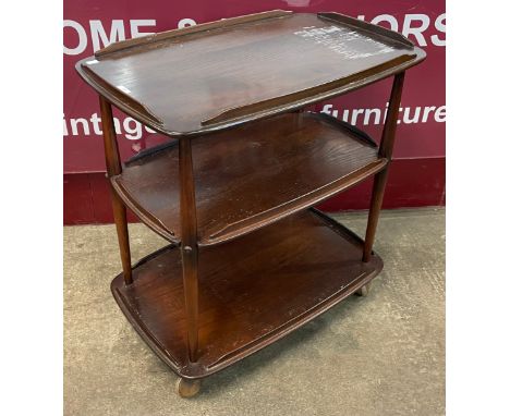An Ercol Golden Dawn elm three tier trolley 