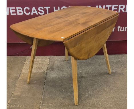 An Ercol elm and beech Windsor drop leaf table 