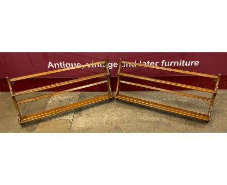 A pair of Ercol Golden Dawn elm wall hanging plate racks 