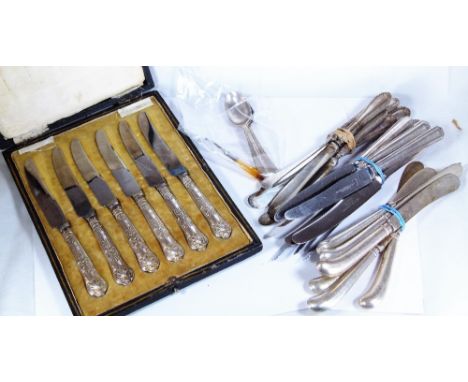 SILVER HANDLED BUTTER KNIVES. Silver pistol handled butter knives including a boxed set in Kings Pattern with teaspoons and a