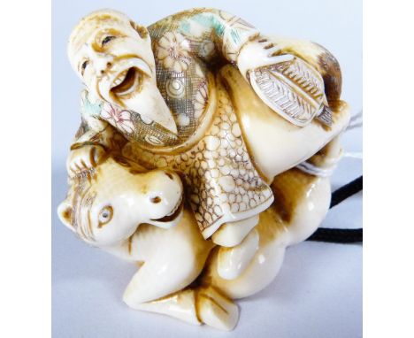 IVORY NETSUKE. Ivory man on horse back netsuke, H - 5 cm