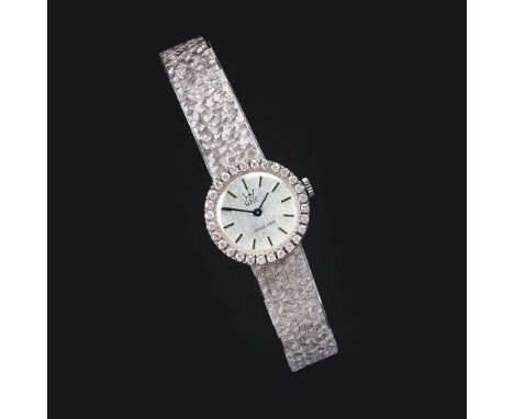 GHC - Gorgerat Horological Company. Damen-Armbanduhr mit Brillanten. Mitte 20. Jh. 18 und 14 kt. WG, gest., poliert und zisel