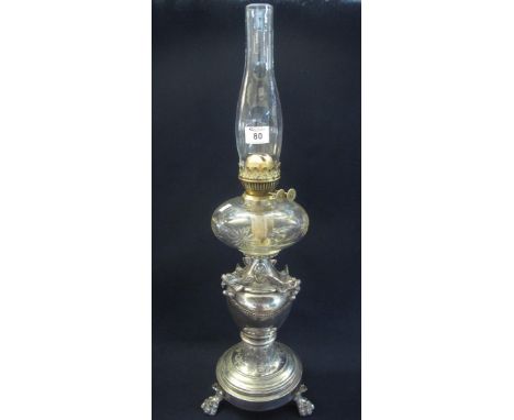 Early 20th Century brass double burner oil lamp with cut clear glass reservoir on a vase shaped classical design silver plate