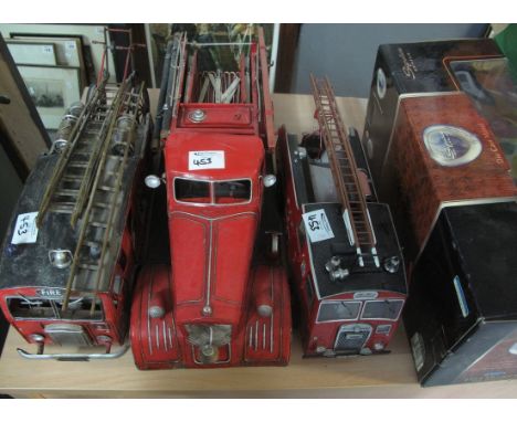 Three modern tinplate fire engine vehicles, together with a 1:18 scale 1914 Model T fire engine featuring a real wood ladder 