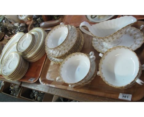 Five trays: four of Spode fine bone china 'Fleu-de-lys Gold' tea and dinnerware items, various to include; lidded tureens, te