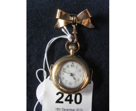 9ct gold bow brooch, together with a 14ct open faced miniature pocket watch converted from a wristwatch. (B.P. 24% incl. VAT)