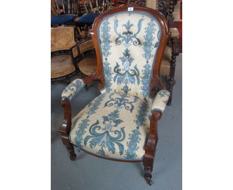Victorian walnut button back foliate upholstered open fireside armchair. (B.P. 24% incl. VAT)