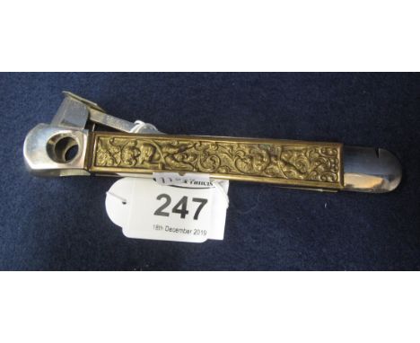 Vintage Solingen cigar cutter with gilded repousse cherub and foliate decoration.(B.P. 24% incl. VAT)