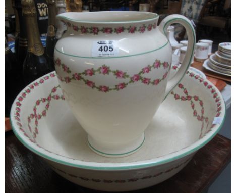 Early 20th Century crescent pottery rose design jug and basin set. (B.P. 24% incl. VAT)