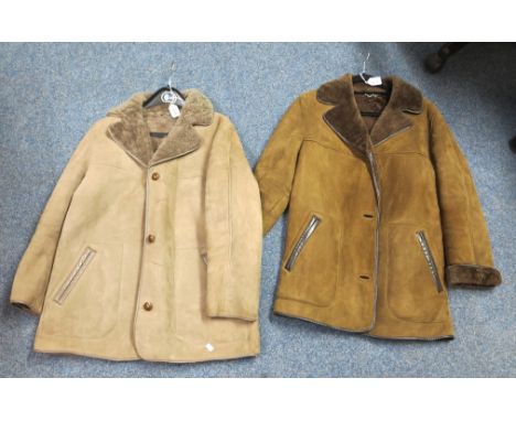Two vintage sheepskin jackets with leather piping and buttons by Morlands, one grey/light brown and the other dark brown. (2)