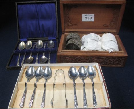 Carved foliate box comprising a set of six silver fill agree napkin ring, together with two cased boxes of plated cutlery, sp