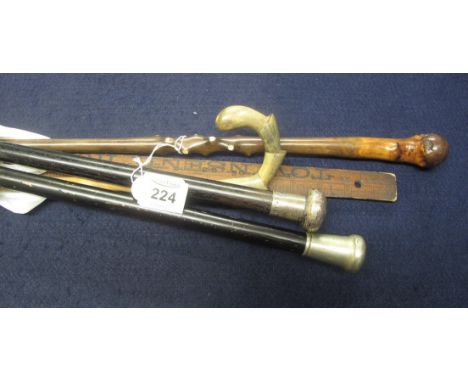 Collection of three gentleman's canes, one with silver collar and lacquered shaft, together with a vintage ruler and vintage 