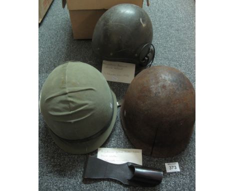 Box of military helmets believed from the Falklands war 1982, to include; two army helmets (believed Argentine made), an armo