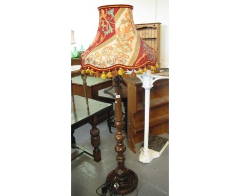 Modern mahogany finish standard lamp with shade on circular moulded base. (B.P. 24% incl. VAT)