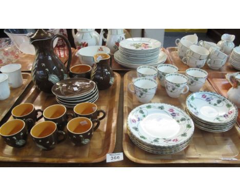 A 15 piece Martin Boyd Australian pottery brown ground coffee set with stylised birds and bugs decoration, together with a tr