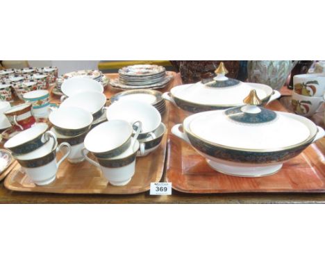 Two trays of Royal Doulton fine bone china 'Carlyle' tea and dinnerware items to include; pair of oval lidded tureens, cups, 