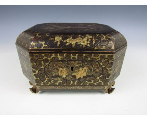 A 19th Century Chinese lacquered tea caddy, of rectangular section, the cover with rounded canted corners, having gilt figura