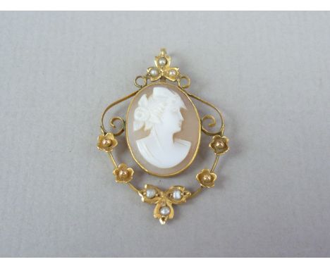 A late 19th / early 20th Century split seed pearl and cameo openwork Art Nouveau pendant, centrally set with a carved shell c