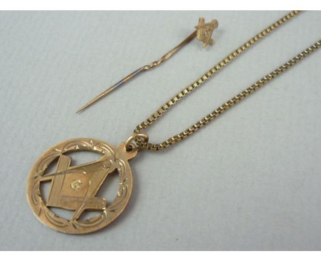 A vintage 9ct gold Masonic pendant, on a yellow metal box link neck chain (a/f), together with a 9ct gold Masonic stick pin, 