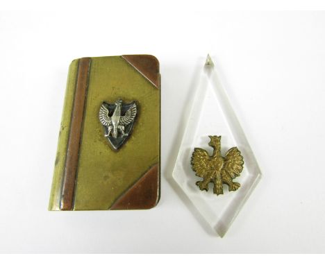 A Second World War Polish Army in Exile 'trench art' pocket lighter, together with a Lucite pendant