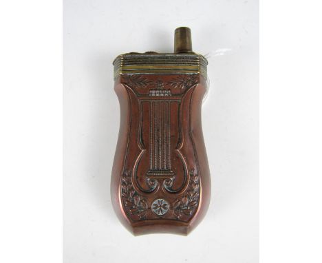 A 19th Century French copper combination pistol powder and shot flask by Nouchet, of lyre form with finely embossed decoratio