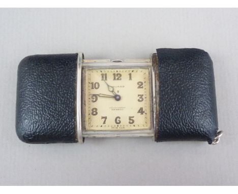 An early 20th Century Movado Chronometre Ermeto silver cased and faux leather vest or purse watch, with slide action, Swiss-m