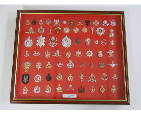 A framed display of British Army cap badges as of 1997