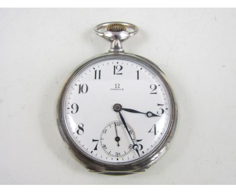 A vintage Omega pocket watch in a white metal case, with crown wound movement, white enamelled face, Arabic numerals and subs