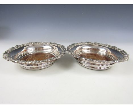 A pair of 19th Century electroplate decanter coasters, 20 cm
