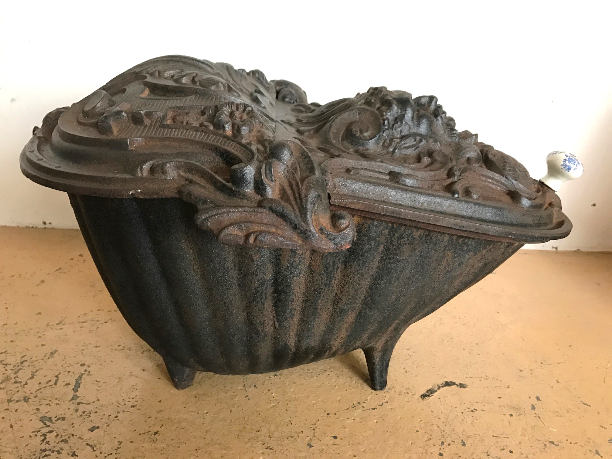 A 19th Century French cast iron coal scuttle by Corneau Freres of