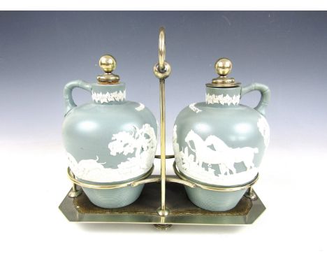 A pair of late 19th / early 20th Century Jasperware type stoneware decanters for 'Whiskey' and 'Brandy', in an electroplate d